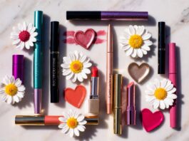 Marc Jacobs Beauty’s Sephora Return Is Fueling Massive Makeup Nostalgia Editorial flatlay of bold luxury makeup products with charm-motif packaging representing the Marc Jacobs Beauty Sephora return and maximalist relaunch collection launching June 1 2026