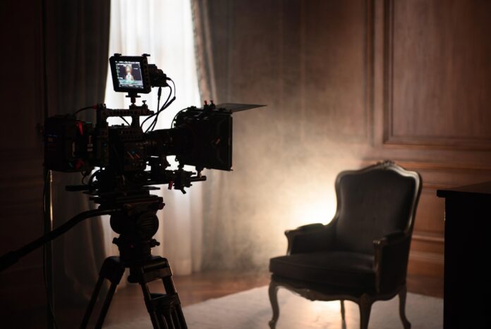 Celebrity Documentaries 2026 — Netflix, Streaming Biographies, and the Format Dominating Entertainment Behind-the-scenes documentary film crew setting up an intimate celebrity interview in a sophisticated studio representing the celebrity documentaries streaming boom of 2026