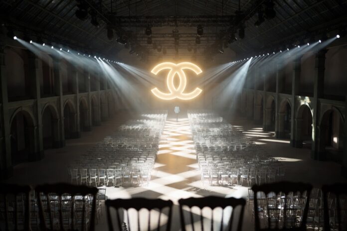 Chanel Creative Directors: From Lagerfeld to Viard — Runway Magazine Grand Parisian fashion show space representing the history of Chanel creative directors from Karl Lagerfeld to Virginie Viard as documented by Runway Magazine