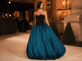 Chrissy Teigen’s Bubble-Skirt Dress Revived Avant-Garde Red Carpet Glamour Chrissy Teigen wearing a strapless black corseted bodice and dramatic teal bubble skirt by Aisté Hong at the 2026 Gold Gala red carpet.