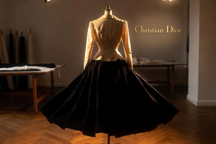 Dior New Look: The 1947 Collection That Changed Fashion — Runway Magazine Dress form in a Parisian atelier displaying the Dior New Look silhouette — cinched jacket and sweeping skirt — representing Runway Magazine's complete history of the 1947 collection that changed fashion