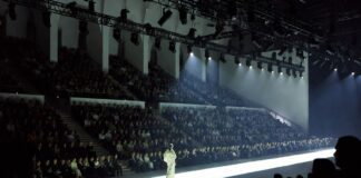 Fashion Weeks Hub: The Complete Global Calendar & Coverage Guide Model walking a runway at a major international fashion week show, representing the complete global fashion week calendar 2026 coverage guide by Runway Magazine