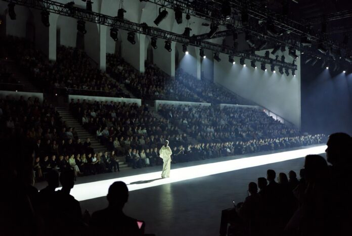 Model walking a runway at a major international fashion week show, representing the complete global fashion week calendar 2026 coverage guide by Runway Magazine