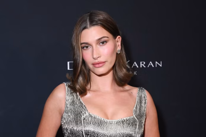 hailey-bieber-at-the-2026-wwd-style-awards-held-at-the-news-photo-1768057110 Hailey Bieber Metallic Gown- Liquid Glamour Trend 2026