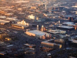 Aerial view of Hollywood studio backlot at golden hour representing the Warner Bros merger and Paramount Skydance $110 billion acquisition reshaping entertainment industry power in 2026