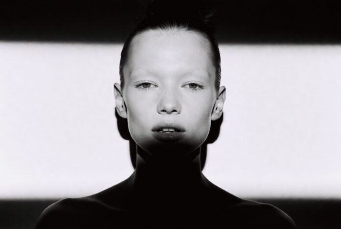 Kate Moss Netflix Documentary 2026 — The Untold Supermodel Story Editorial black-and-white portrait evoking 1990s supermodel fashion photography representing the rumored Kate Moss Netflix documentary and the cultural legacy of her Calvin Klein campaigns
