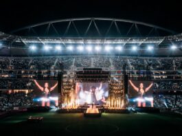 Shakira-inspired World Cup anthem performance with global stadium concert atmosphere