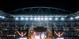 Shakira-inspired World Cup anthem performance with global stadium concert atmosphere