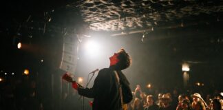 Artist performing during an intimate small venue concert in 2026