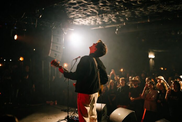 The Rise of Intimate Concert Venues Artist performing during an intimate small venue concert in 2026
