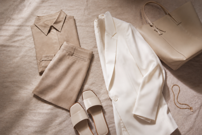 Editorial flat-lay of a 2026 TikTok Shop fashion haul featuring a neutral co-ord set, oversized white blazer, minimalist sandals, and a structured tote in a clean girl aesthetic arrangement.