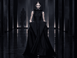 A Balenciaga runway model in a sculptural black gown at Paris Fashion Week, representing the Piccioli couture era.