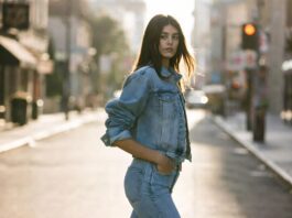 Kaia Gerber’s Evolution From Celebrity Daughter to Fashion Powerhouse Continues Model in a relaxed denim look walks a sunlit street with an effortless, off-duty pose.