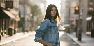 Kaia Gerber’s Evolution From Celebrity Daughter to Fashion Powerhouse Continues Model in a relaxed denim look walks a sunlit street with an effortless, off-duty pose.