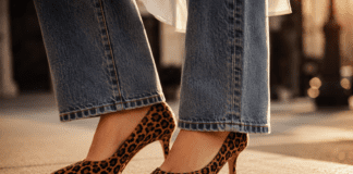 Leopard print heels paired with minimalist separates on a city sidewalk during summer street style season
