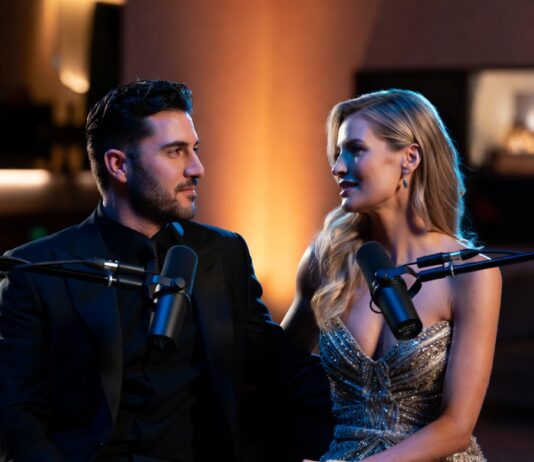 Elegant podcast interview scene featuring a stylish couple seated before studio microphones in a luxury recording space with warm cinematic lighting and intimate conversation atmosphere.