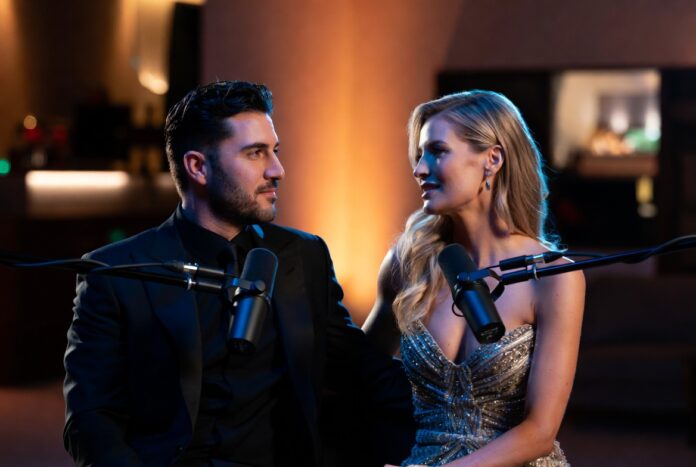Luxury Podcast Interview Couple in Elegant Studio Setting Elegant podcast interview scene featuring a stylish couple seated before studio microphones in a luxury recording space with warm cinematic lighting and intimate conversation atmosphere.