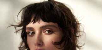 Messy bangs and shattered fringe hair trend 2026 showing soft textured effortless fringe representing the curtain bangs alternative French girl fringe and low maintenance hairstyles aesthetic worn by celebrities including Jennifer Lawrence Zoë Kravitz and Emma Stone as the defining bangs trend 2026 and summer hair trend.