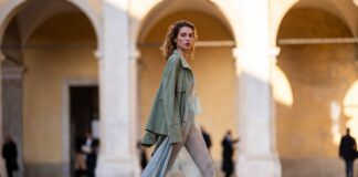 Milan street style outfit pairing suede, lace, and silver shoes in a study of textural contrast outside the shows