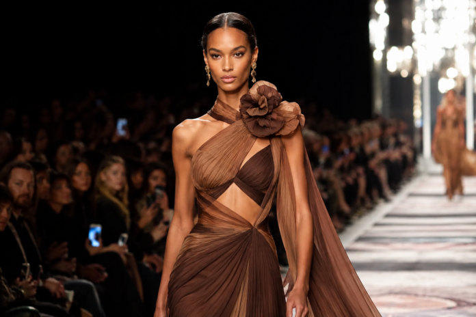 Mona Tougaard Luxury Fashion Runway Model 2026 A high fashion model walking a luxury runway show in an elegant designer look under bright runway lighting