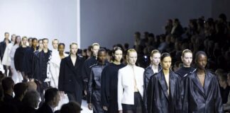 A diverse group of rising female fashion models walking a luxury runway show during Paris Fashion Week