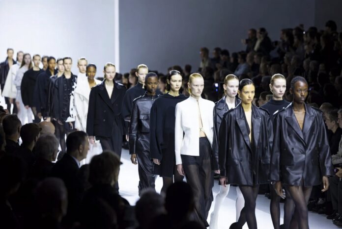 New Supermodels Rising Female Models 2026 A diverse group of rising female fashion models walking a luxury runway show during Paris Fashion Week