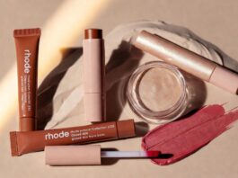 Rhode’s Summer Collection Is Dominating Beauty Conversations Across Social Media Rhode Summer Collection 2026 product flatlay featuring Pocket Bronze cream bronzer stick and Highlight Milk hybrid luminizer representing the Hailey Bieber Rhode glazed skin trend viral beauty products summer makeup trends and beauty launches 2026 Rhode beauty launch moment.