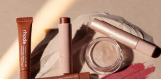 Rhode Summer Collection 2026 product flatlay featuring Pocket Bronze cream bronzer stick and Highlight Milk hybrid luminizer representing the Hailey Bieber Rhode glazed skin trend viral beauty products summer makeup trends and beauty launches 2026 Rhode beauty launch moment.