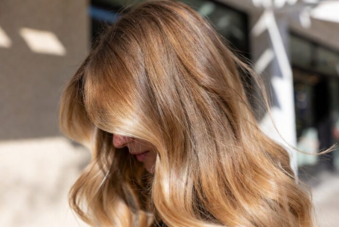 Strawberry Blonde Hair Trend 2026 Strawberry blonde hair featuring soft copper blonde tones and natural dimension