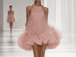 Summer 2026 Fashion Trends Are Being Defined by Designer Creativity and Bold Individuality Model in a sculptural bubble hem dress in ice-cream pink tulle and organza on an SS26 fashion runway.