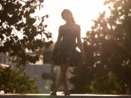 Summer Runway Trends 2026 Embrace Sculptural Silhouettes and Soft Glamour A model in a sculptural bubble-hem dress with dramatic volume styled minimally on a summer runway