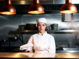 The Bear Season 5 Gives Ayo Edebiri Her Defining TV Era Young female chef in a warm restaurant kitchen reflecting the emotional force of prestige television