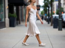 Woman wearing ballet sneakers in a street style 2026 setting representing the sneakerina trend combining ballet flat elegance with sneaker comfort as worn by celebrities in NYC street style and fashion week street style including Adidas ballet sneakers Puma ballet sneakers and Louis Vuitton sneakerina.