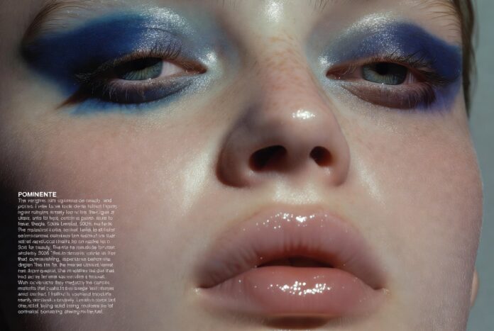 Beauty Trends 2026 — Bold Eyes, Juicy Lips, and the Cellness Skincare Era Define the Next Chapter Editorial beauty close-up featuring bold blue eyeshadow and juicy blurred lips against luminous skin representing the beauty trends 2026 moment including cellness skincare glow bold makeup trend blue eyeshadow trend and the departure from minimalist beauty aesthetics.