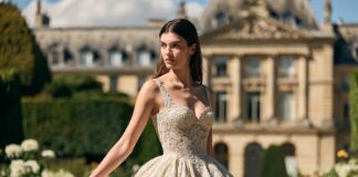 Model in ivory needle-lace embroidered couture gown in a Parisian museum garden representing the Dior couture 2026 Spring Summer haute couture collection reviewed by Runway Magazine