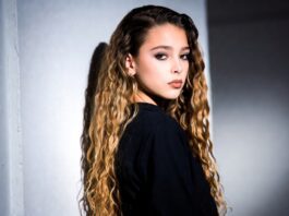 Alex Consani’s Rise Signals a New Era for the Modern Supermodel Model in a sleek runway-ready look poses against a minimal studio backdrop with soft lighting.