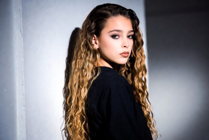 ex Consani's 2026 Supermodel Rise Era Begins Model in a sleek runway-ready look poses against a minimal studio backdrop with soft lighting.