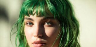 Model with vibrant saturated neon green hair in warm summer editorial lighting representing the neon green hair trend and bold hair colors summer 2026 comeback in beauty culture and fashion