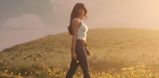 Ella Langley American Eagle Campaign Makes Denim Country Ella Langley Dark-wash denim, white tank and cowboy boots styled inside a rustic barn for a country campaign