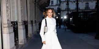 Sarah Jessica Parker Revives the Fendi Baguette for 2026 Woman in a monochrome couture ensemble carries a black-and-white beaded shoulder bag at an evening fashion show