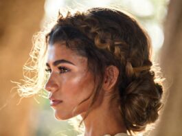 Zendaya Goddess Braid Makes Heat-Proof Hair Couture Grecian braided crown and sculpted bun styled with waist-length brunette waves for a polished summer look