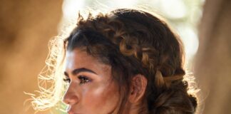 Grecian braided crown and sculpted bun styled with waist-length brunette waves for a polished summer look