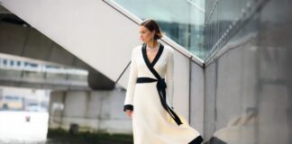Black-and-white Chanel-inspired wrap dress at a polished London film photocall setting