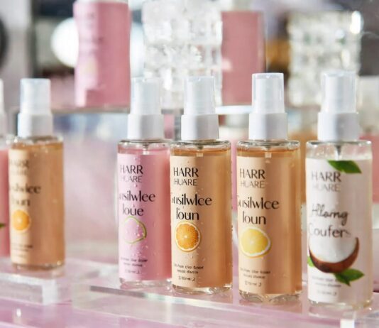 NYX Fragrance Enters the $15 Body-Mist Race for Gen Z Colorful body mist bottles styled in a glossy Gen Z beauty editorial fragrance scene