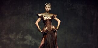 Teyana Taylor Ashi Studio Armor Look Goes Viral at Paris Couture A model in a sculptural bronze crocodile-leather armor corset with a fringe skirt and spiral headpiece