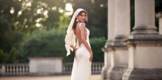 Zendaya The Odyssey Look: A Custom Jacquemus Greek Goddess Moment A woman in a flowing ivory column goddess gown with a draped headscarf and gold jewelry